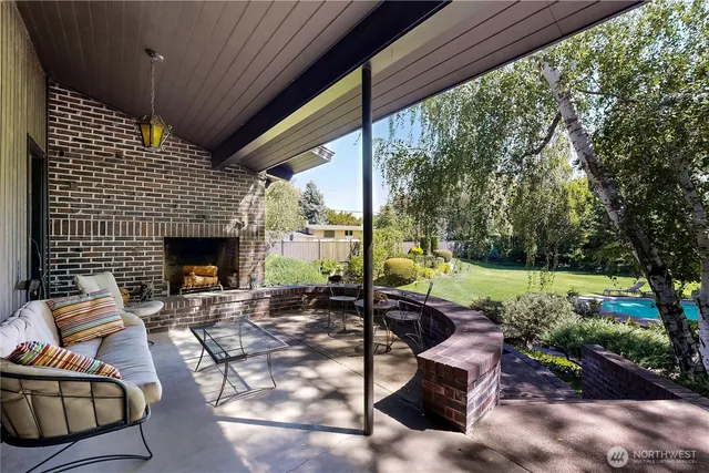a view of a garden with an outdoor seating