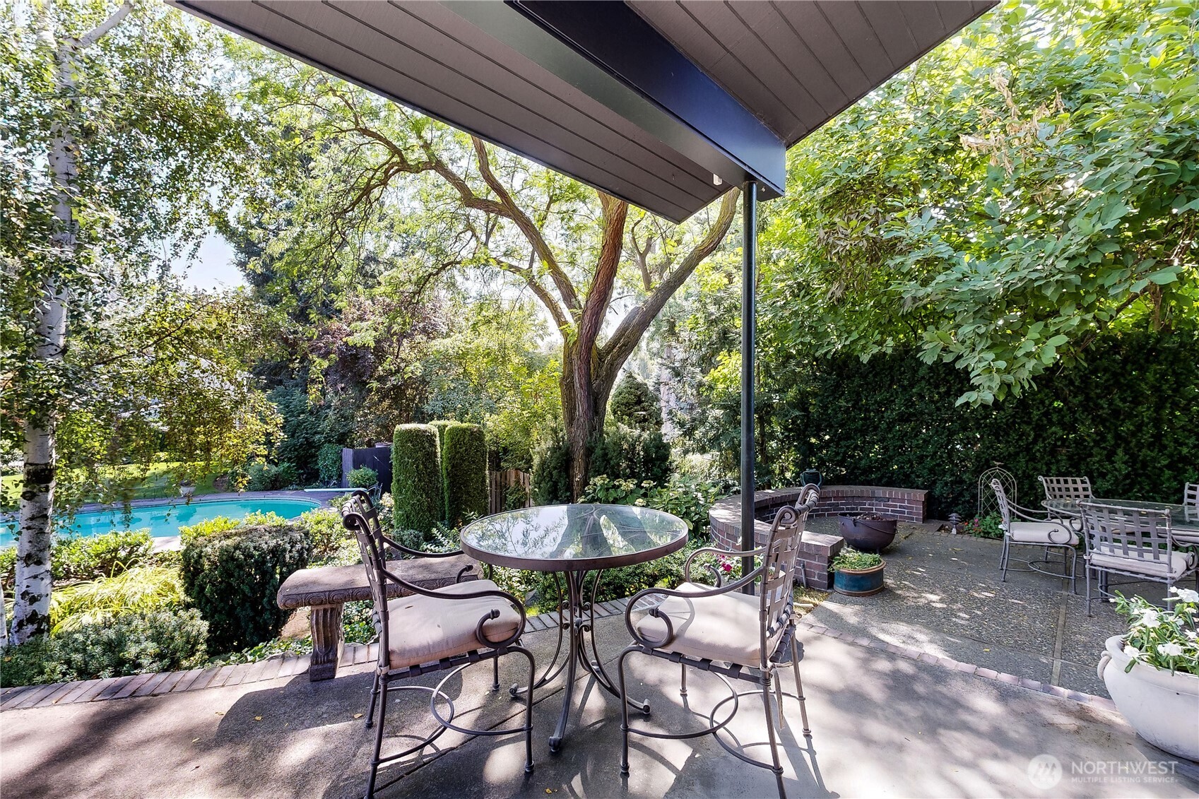 240 Stone Street Walla Walla, WA 99362 - Photo 35 of 40 a view of a table and chairs in backyard under a large tree