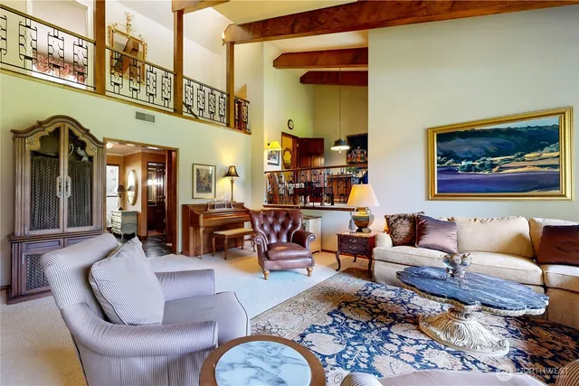 a dining room with furniture window and wooden floor