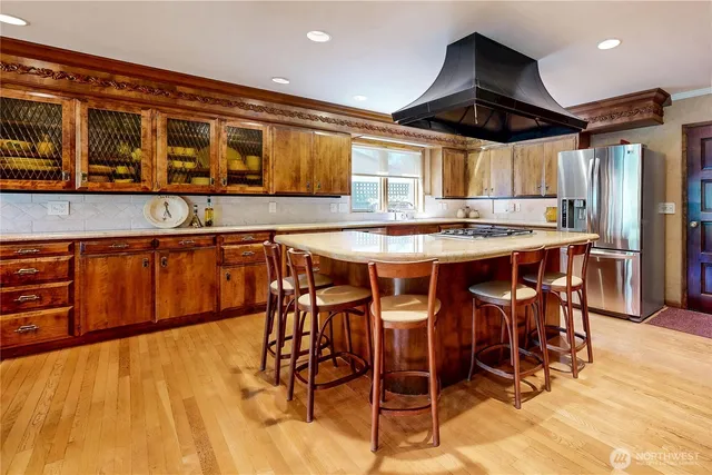 a kitchen with stainless steel appliances granite countertop a sink and cabinets