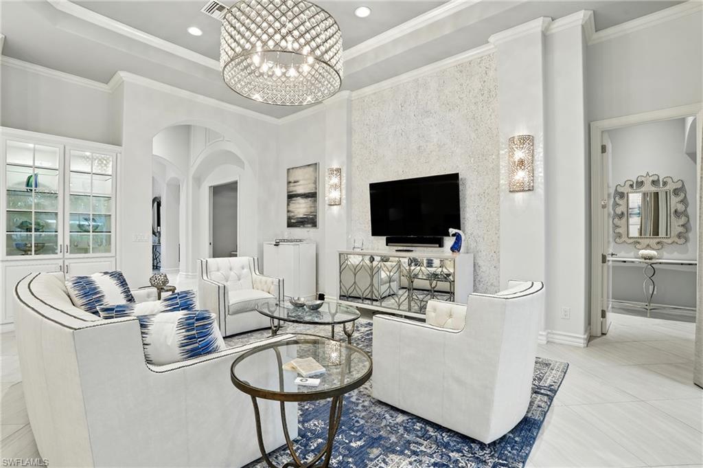 17483 Via Navona Way Miromar Lakes, FL 33913 - Photo 19 of 50 a living room with furniture and a flat screen tv