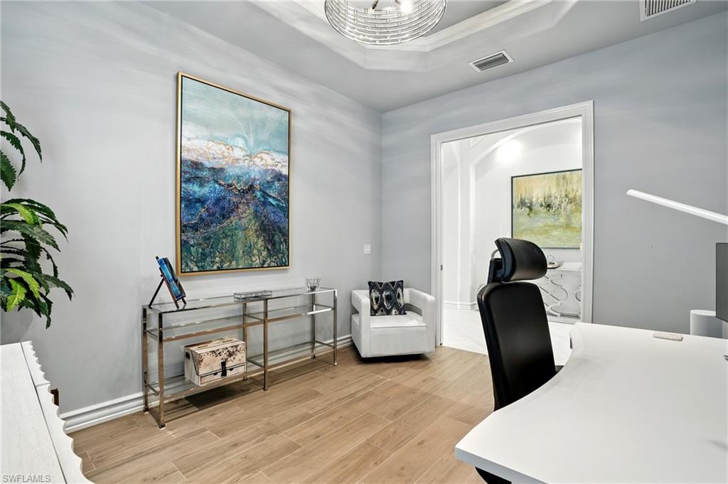 17483 Via Navona Way Miromar Lakes, FL 33913 - Photo 30 of 50 a living room with furniture and a large window