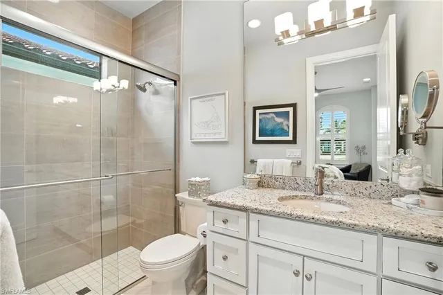 a bedroom with a large bed and a flat screen tv