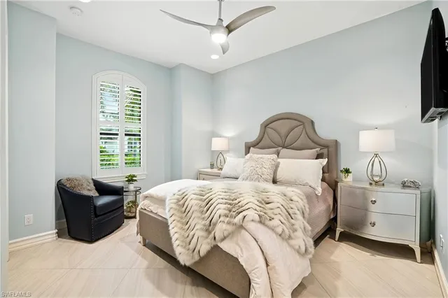 a bed room with a bed and a window