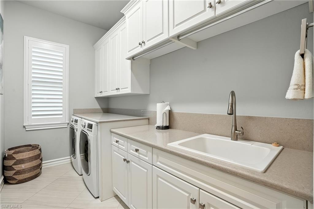 17483 Via Navona Way Miromar Lakes, FL 33913 - Photo 38 of 50 a kitchen with a sink and a stove top oven