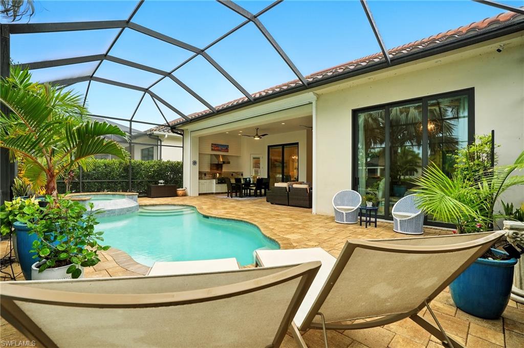 17483 Via Navona Way Miromar Lakes, FL 33913 - Photo 40 of 50 a view of house with swimming pool outdoor seating