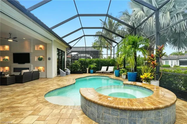a view of a swimming pool with a patio