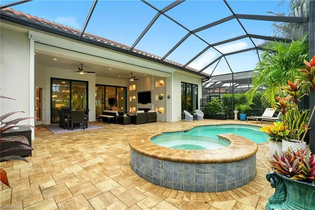 a view of a swimming pool with a patio