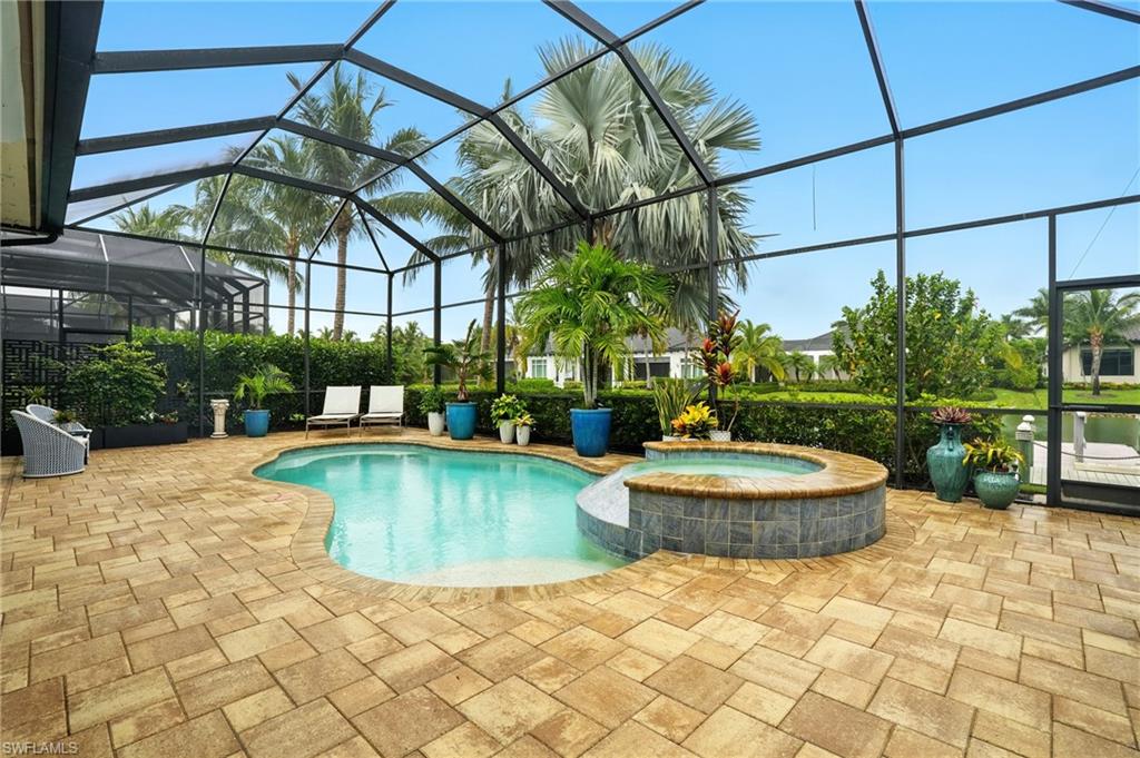 17483 Via Navona Way Miromar Lakes, FL 33913 - Photo 43 of 50 a view of a swimming pool with a patio