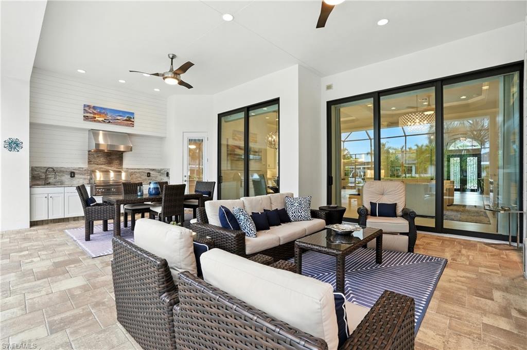 17483 Via Navona Way Miromar Lakes, FL 33913 - Photo 44 of 50 a living room with furniture and large windows