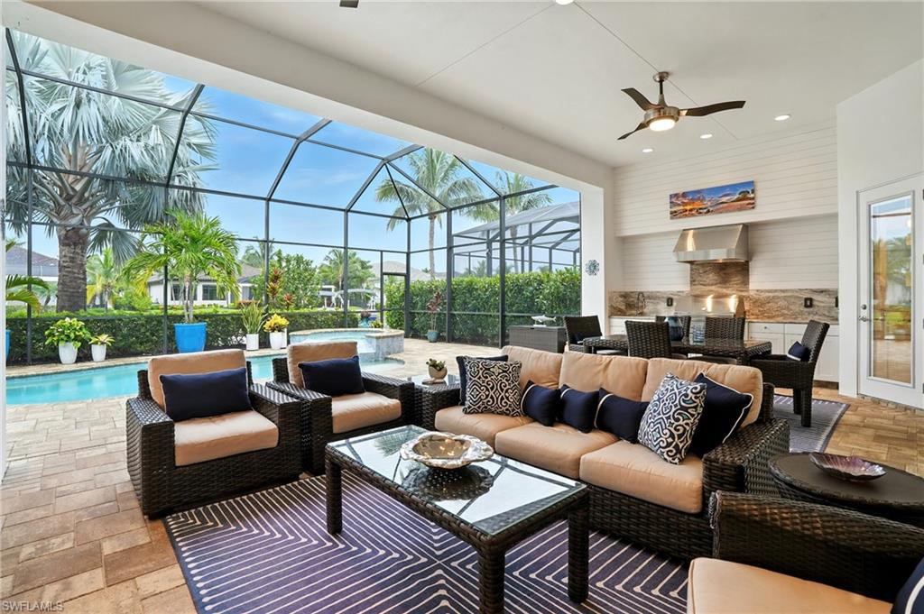 17483 Via Navona Way Miromar Lakes, FL 33913 - Photo 48 of 50 a living room with furniture and a large window