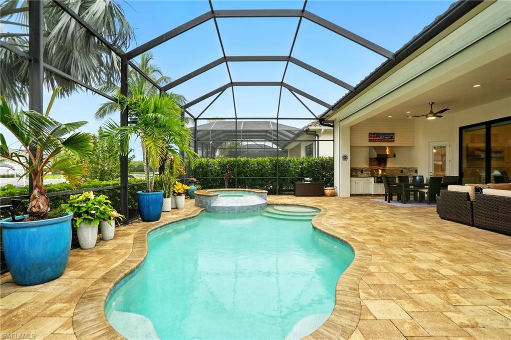 17483 Via Navona Way Miromar Lakes, FL 33913 - Photo 49 of 50 a view of a backyard with swimming pool