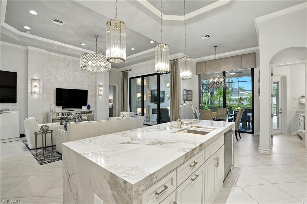 17483 Via Navona Way Miromar Lakes, FL 33913 - Photo 5 of 50 a large kitchen with kitchen island a large island in it