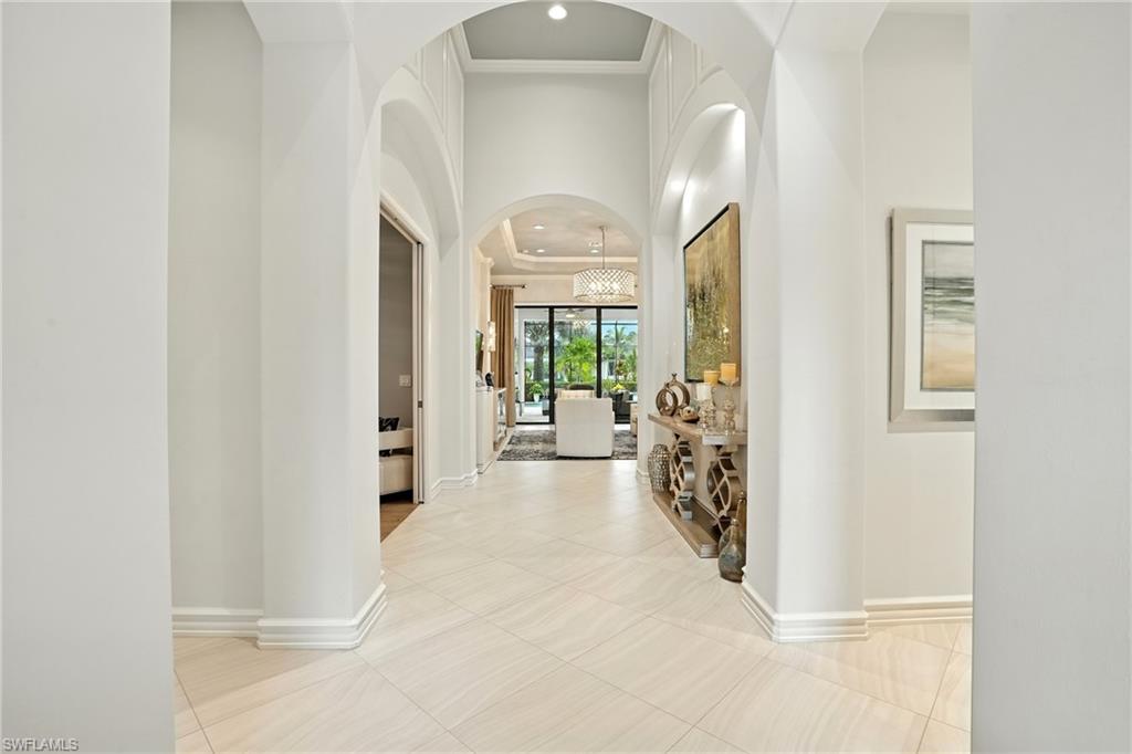 17483 Via Navona Way Miromar Lakes, FL 33913 - Photo 7 of 50 a view of a hallway with windows and a livingroom view
