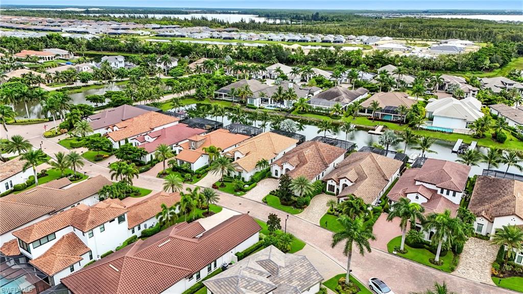17483 Via Navona Way Miromar Lakes, FL 33913 - Photo 9 of 50 an aerial view of residential houses with outdoor space