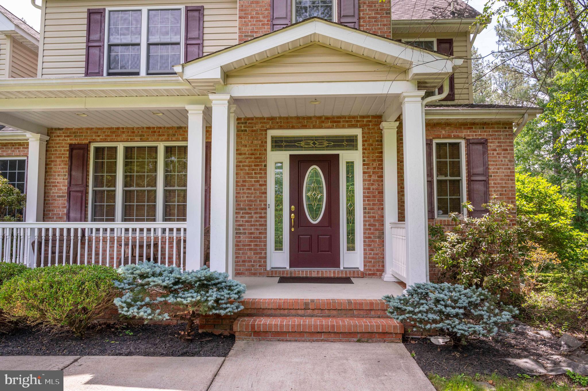 168 Thomas Drive Middletown, VA 22645 - Photo 22 of 66 a front view of a house with a garden