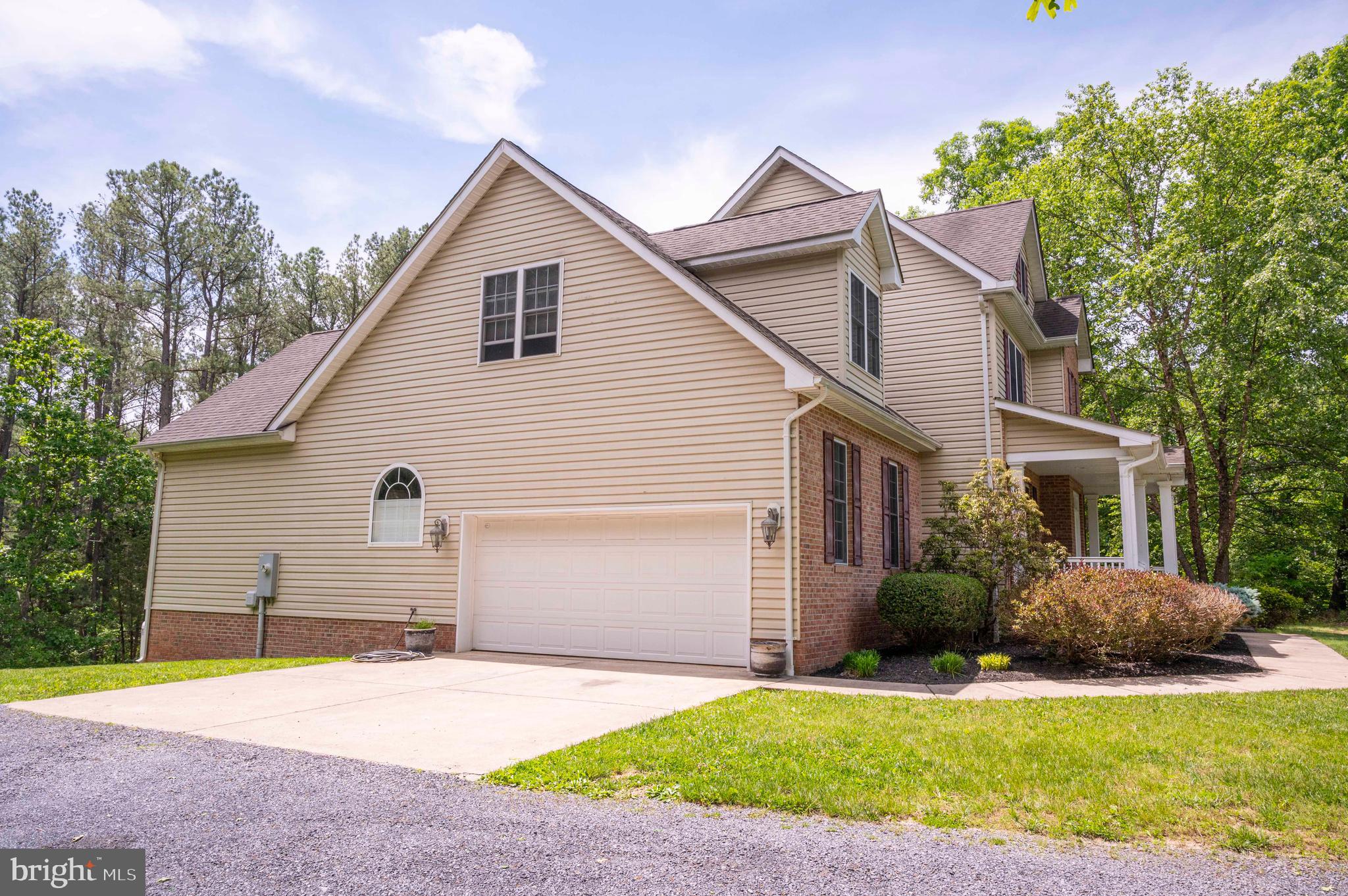168 Thomas Drive Middletown, VA 22645 - Photo 26 of 66 a front view of a house with a yard and garage
