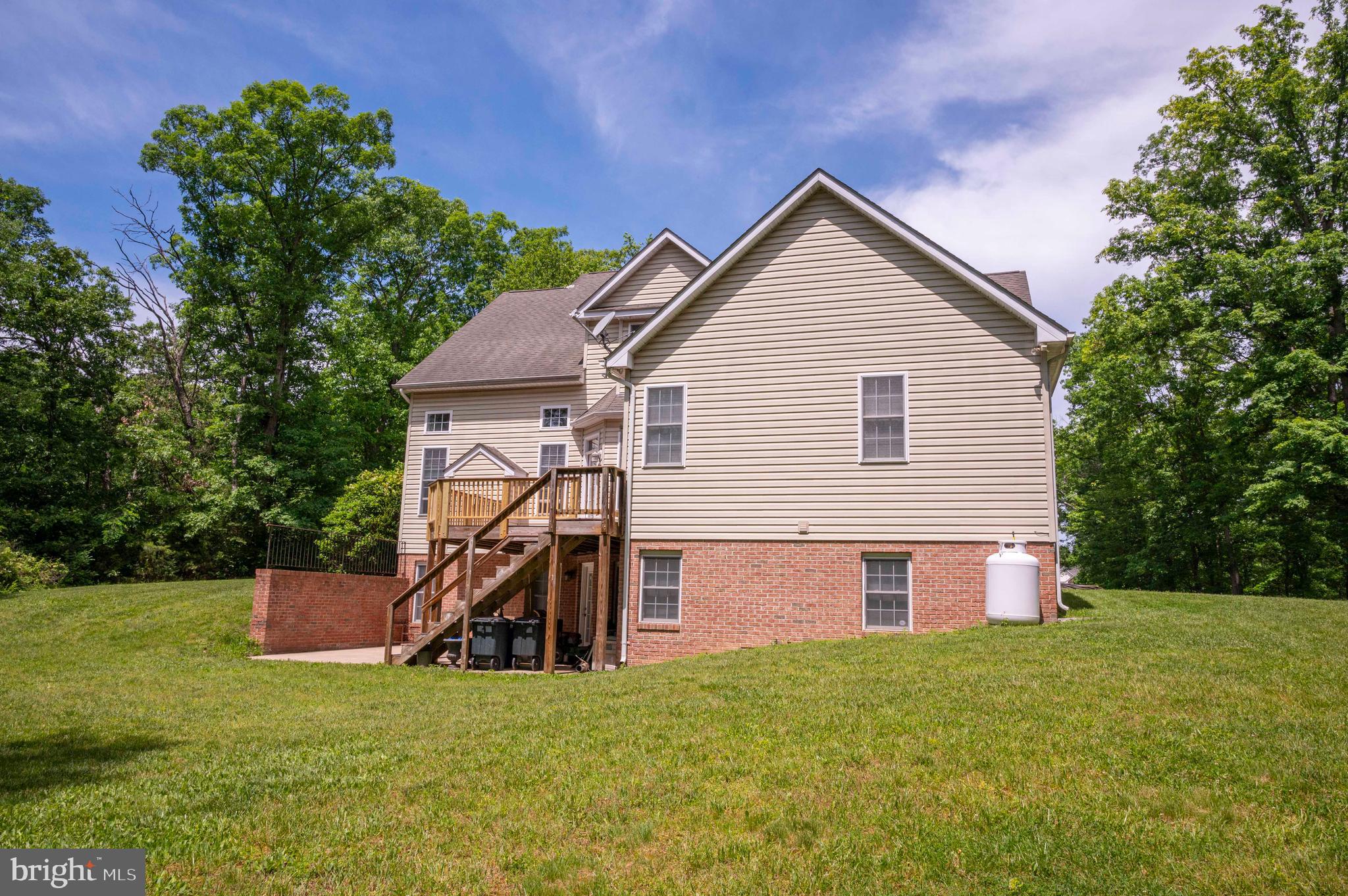 168 Thomas Drive Middletown, VA 22645 - Photo 27 of 66 a view of a house with backyard and a tree