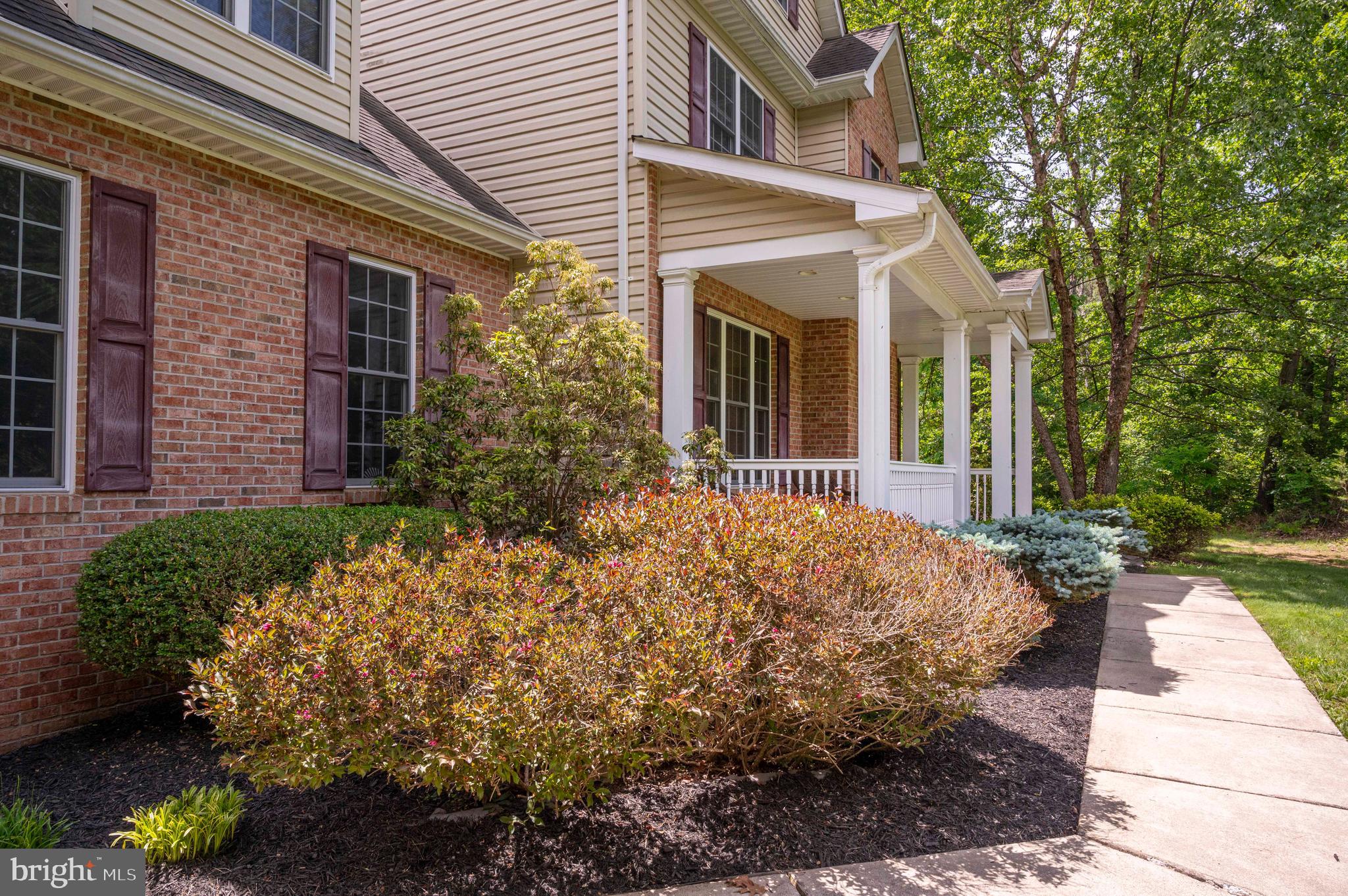 168 Thomas Drive Middletown, VA 22645 - Photo 34 of 66 a view of a white house with a yard and potted plants