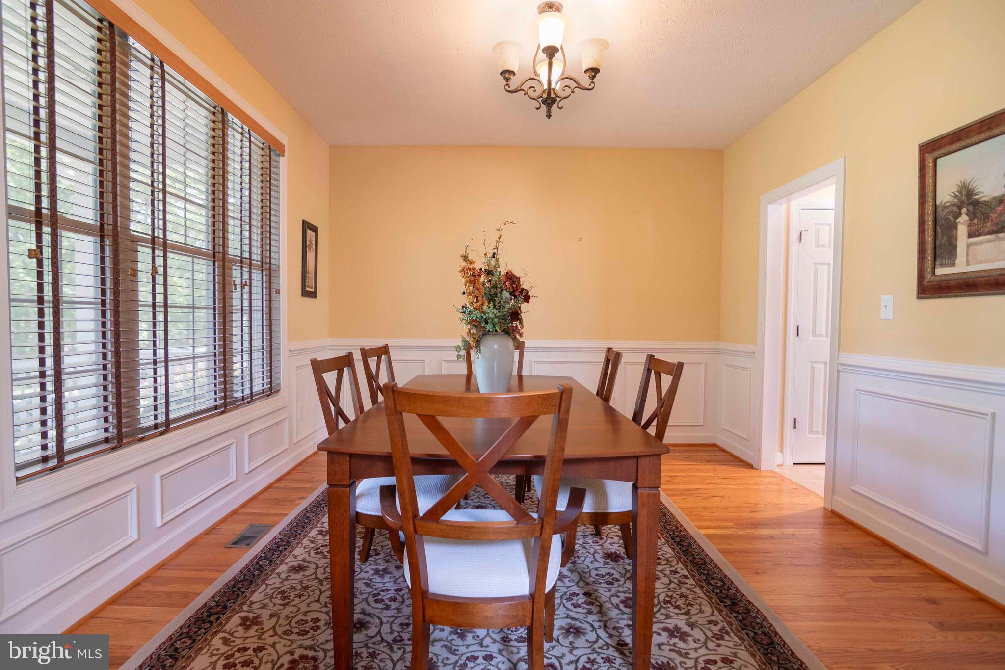 168 Thomas Drive Middletown, VA 22645 - Photo 37 of 66 a view of a dining room with furniture window and wooden floor