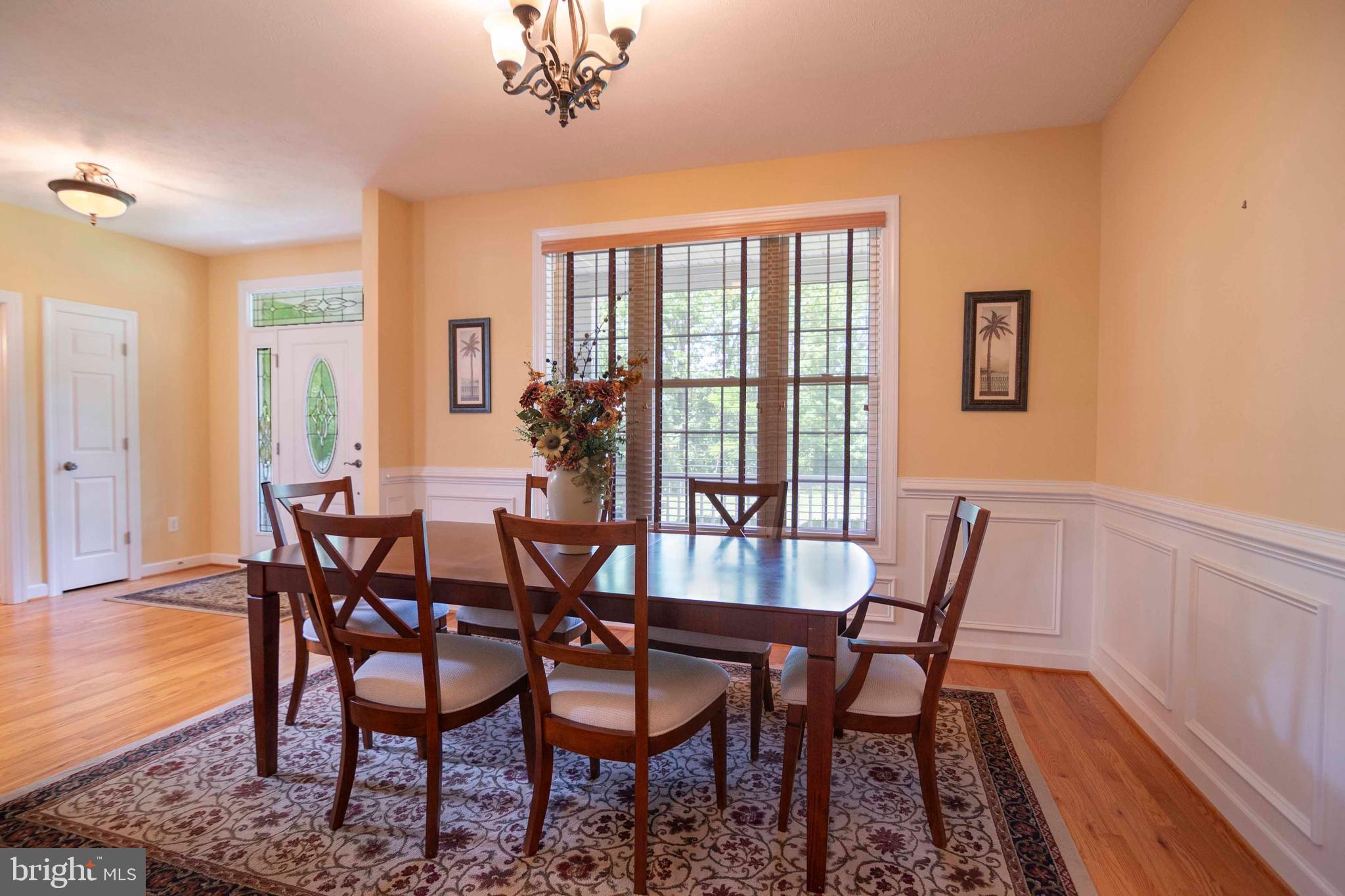 168 Thomas Drive Middletown, VA 22645 - Photo 40 of 66 a view of a dining room with furniture window and wooden floor