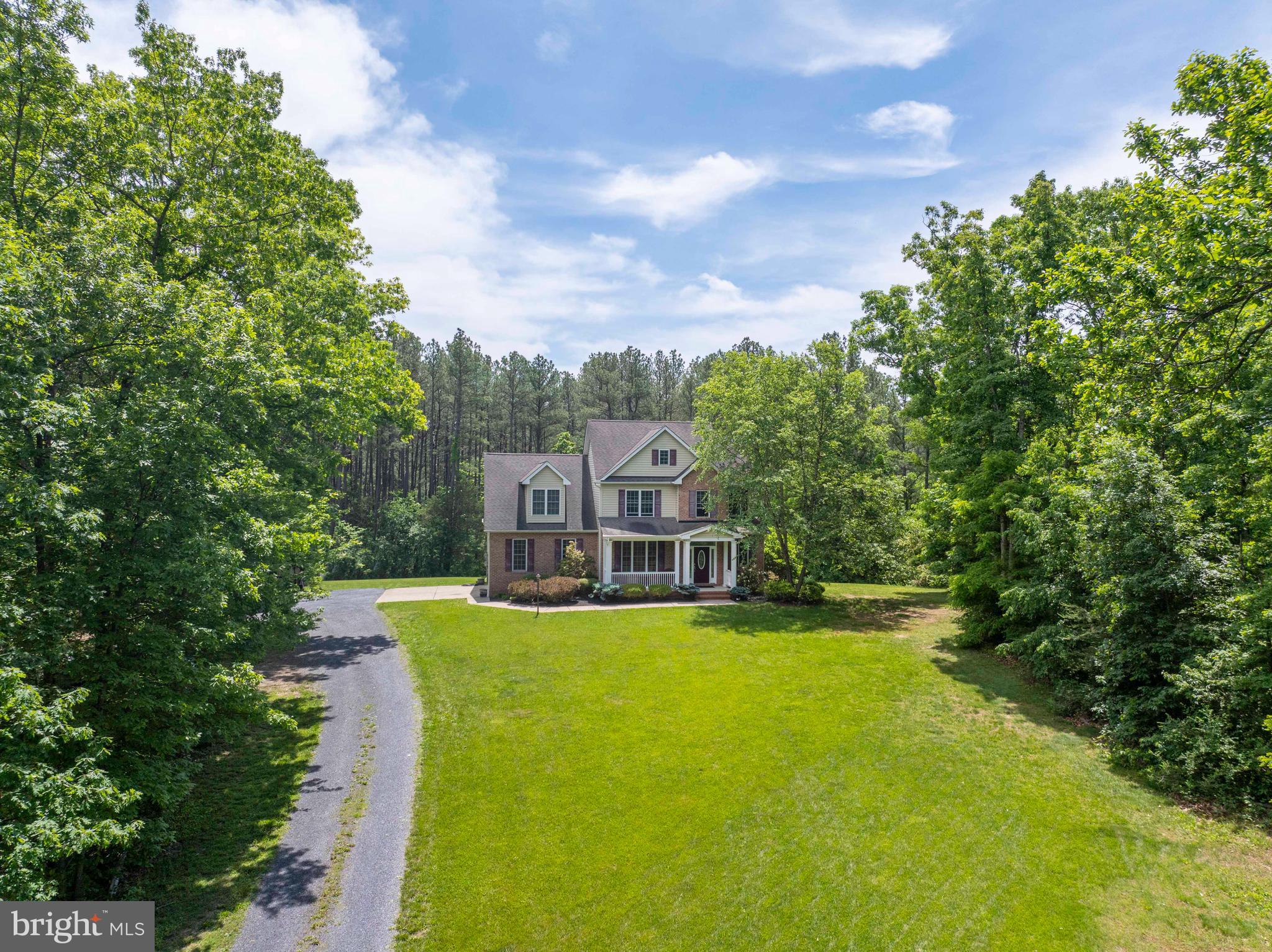 168 Thomas Drive Middletown, VA 22645 - Photo 4 of 66 a view of a house with a big yard and large trees
