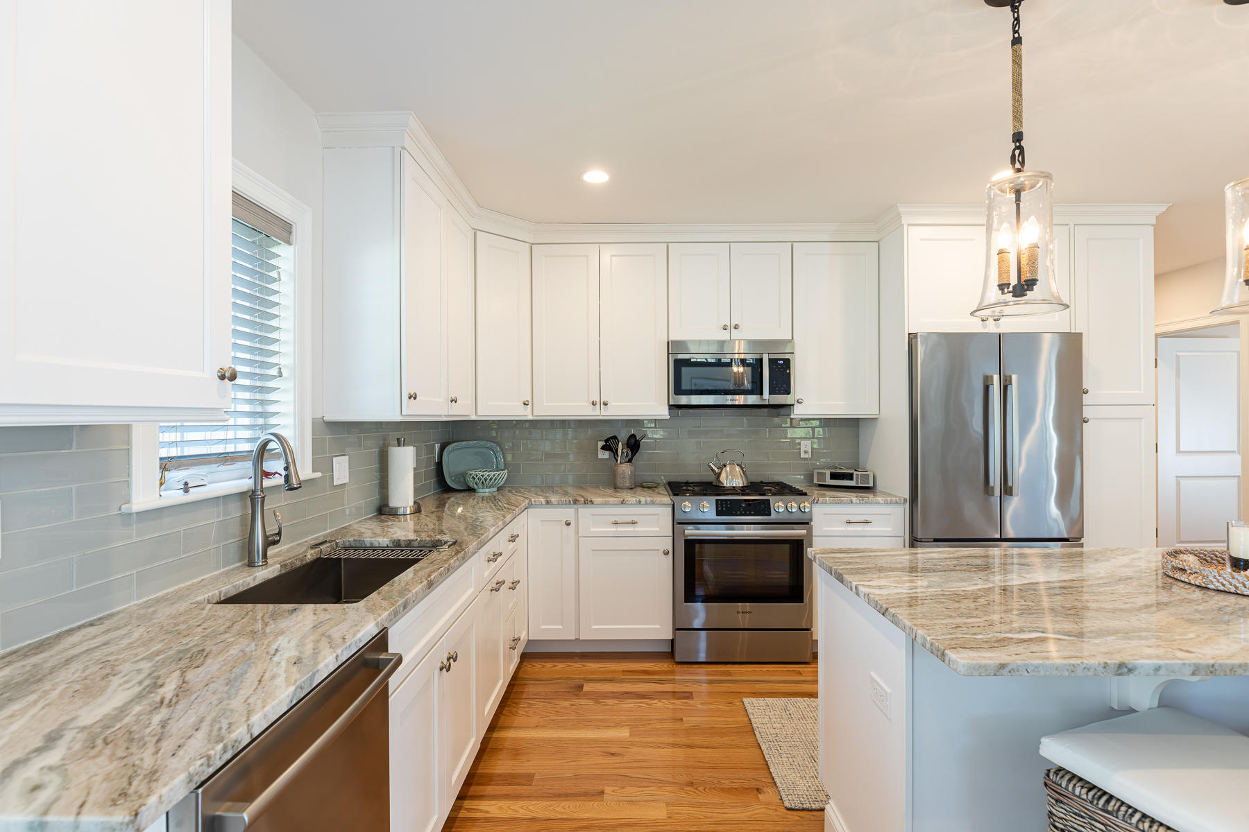62 Cottage Lane Mashpee, MA 02649 - Photo 14 of 64 a kitchen with stainless steel appliances granite countertop a sink stove and refrigerator
