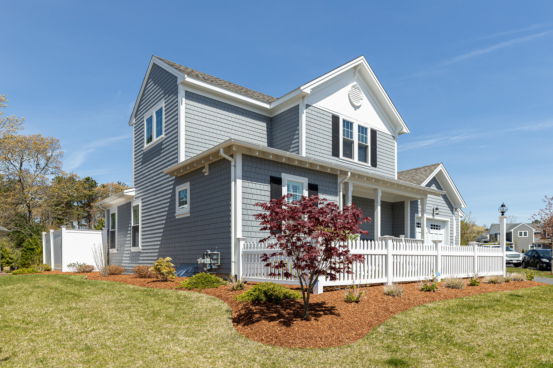 62 Cottage Lane Mashpee, MA 02649 - Photo 2 of 64 a front view of a house with a yard