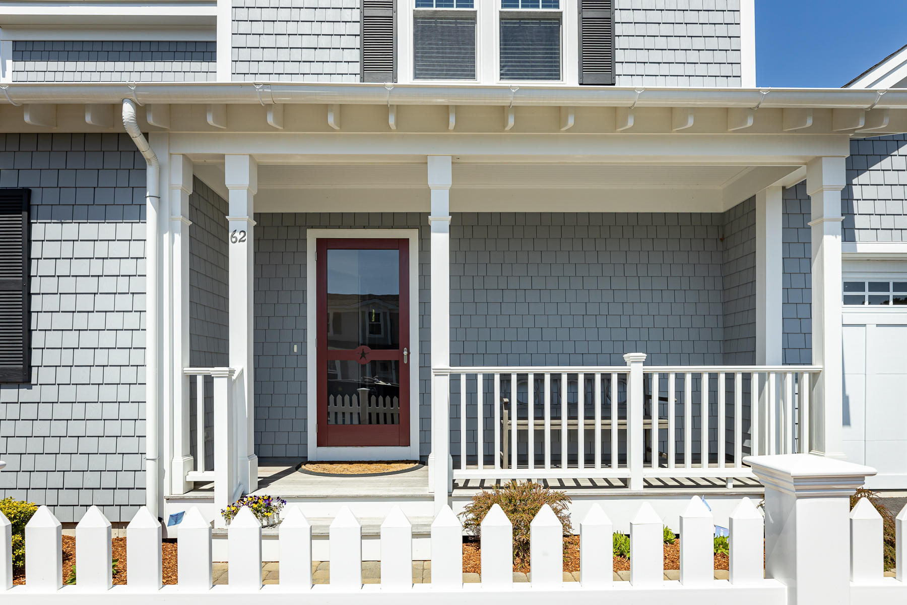 62 Cottage Lane Mashpee, MA 02649 - Photo 3 of 64 a front view of a house with a fence