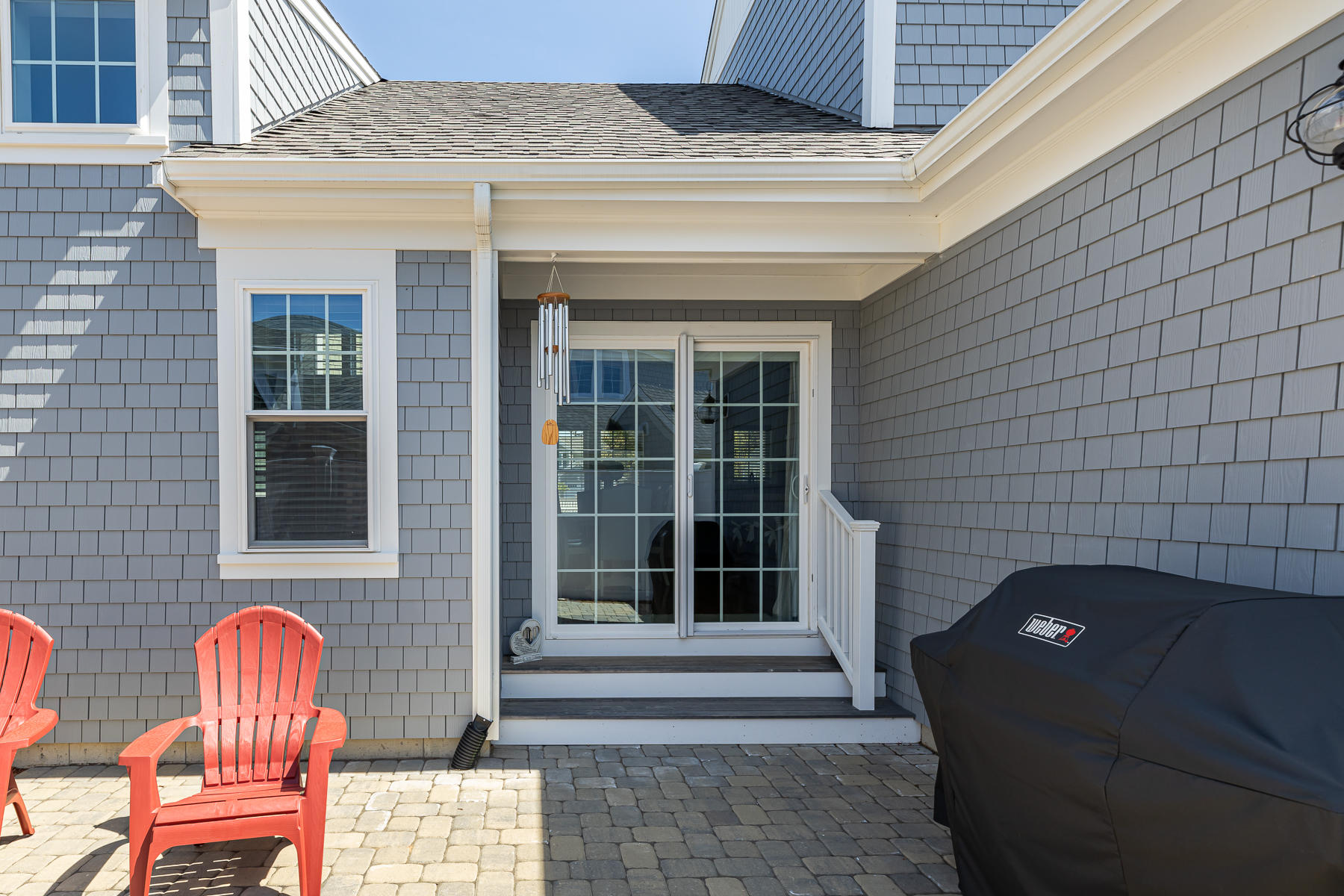 62 Cottage Lane Mashpee, MA 02649 - Photo 54 of 64 a front view of a house with a chairs