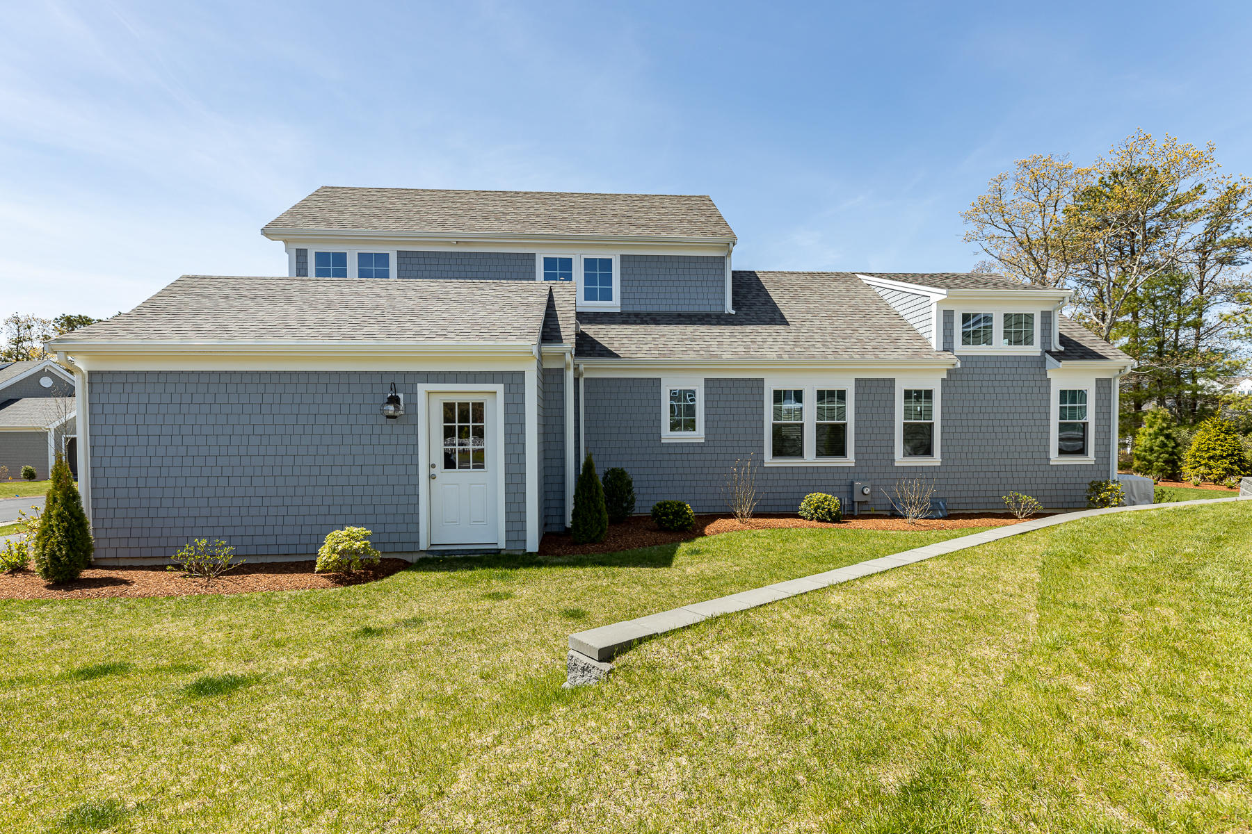 62 Cottage Lane Mashpee, MA 02649 - Photo 55 of 64 a front view of a house with a yard