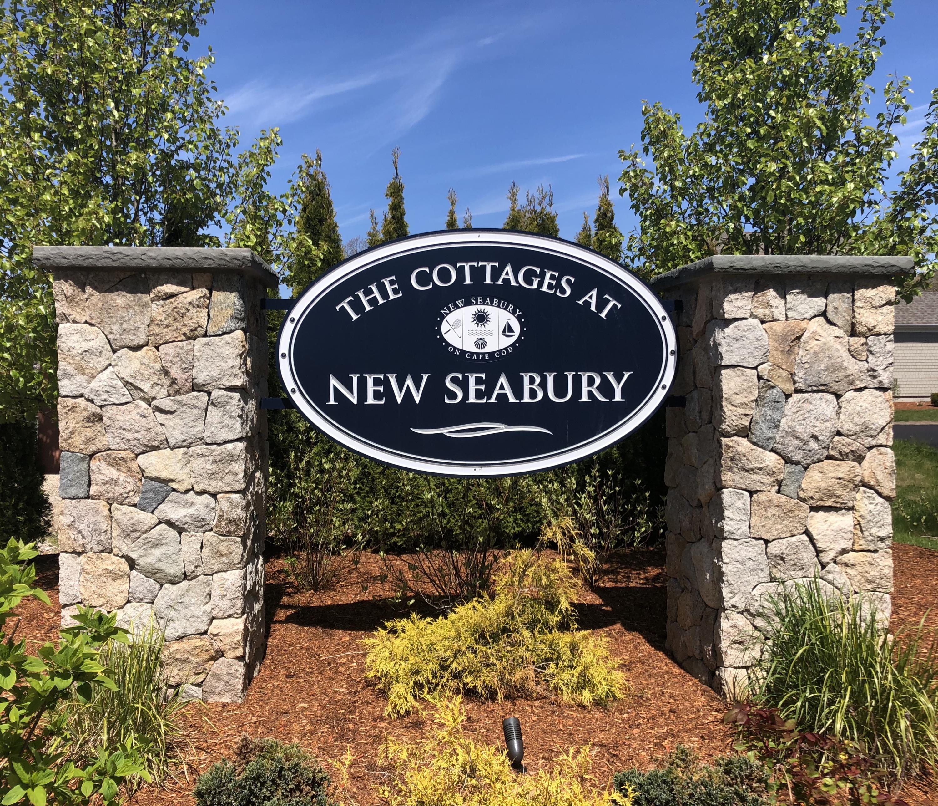 62 Cottage Lane Mashpee, MA 02649 - Photo 57 of 64 a sign that is sitting in front of a building
