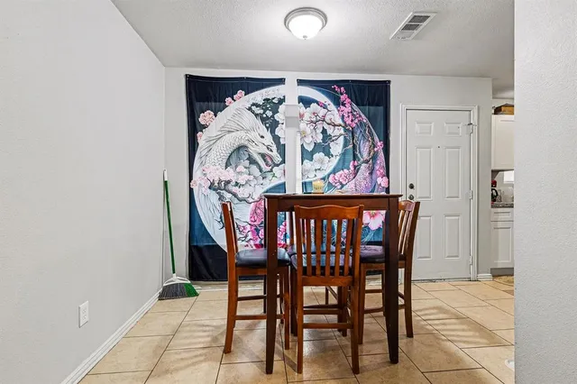 a kitchen with a refrigerator and a stove