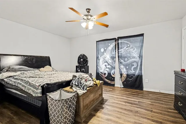 a bathroom with a sink and mirror with toilet
