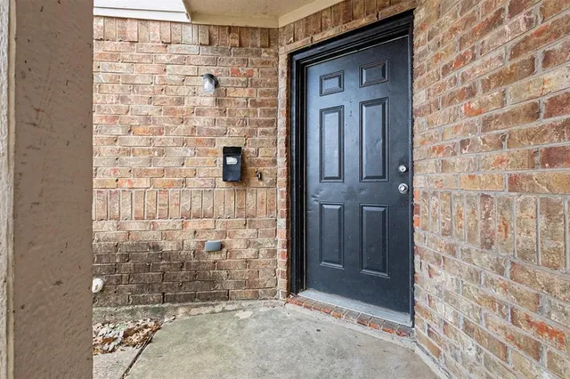 a view of a bathroom with mirror