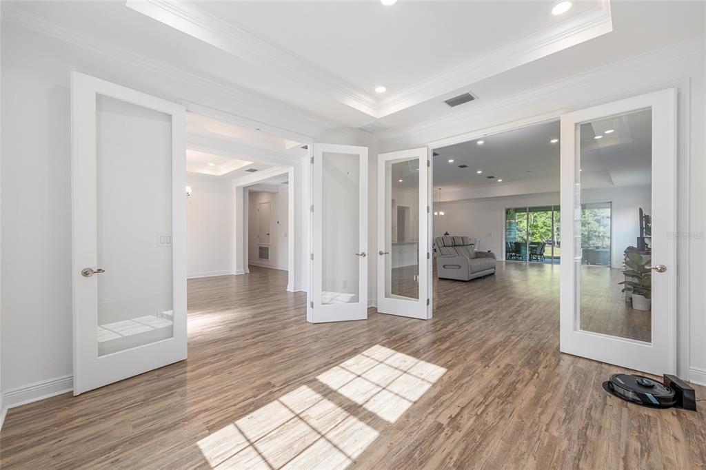 69 Grass Street Homosassa, FL 34446 - Photo 13 of 72 a view of a hallway with wooden floor and a bathroom
