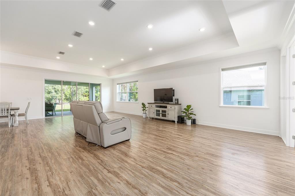 69 Grass Street Homosassa, FL 34446 - Photo 16 of 72 a living room with furniture and a wooden floor