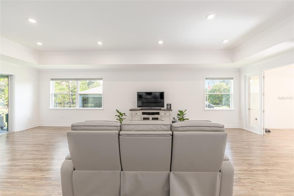 69 Grass Street Homosassa, FL 34446 - Photo 17 of 72 a living room with furniture and a flat screen tv