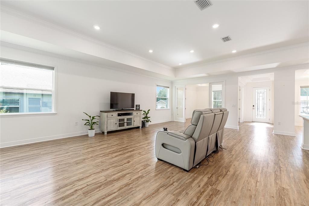 69 Grass Street Homosassa, FL 34446 - Photo 18 of 72 a living room with furniture and a flat screen tv