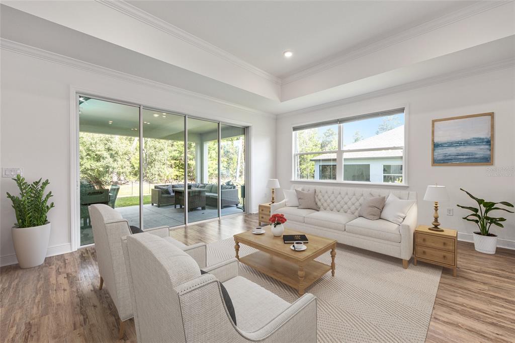 69 Grass Street Homosassa, FL 34446 - Photo 21 of 72 a living room with furniture and a large window