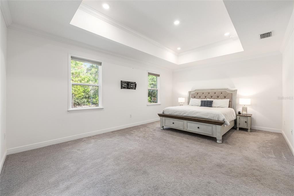 69 Grass Street Homosassa, FL 34446 - Photo 32 of 72 a spacious bedroom with a bed and a window