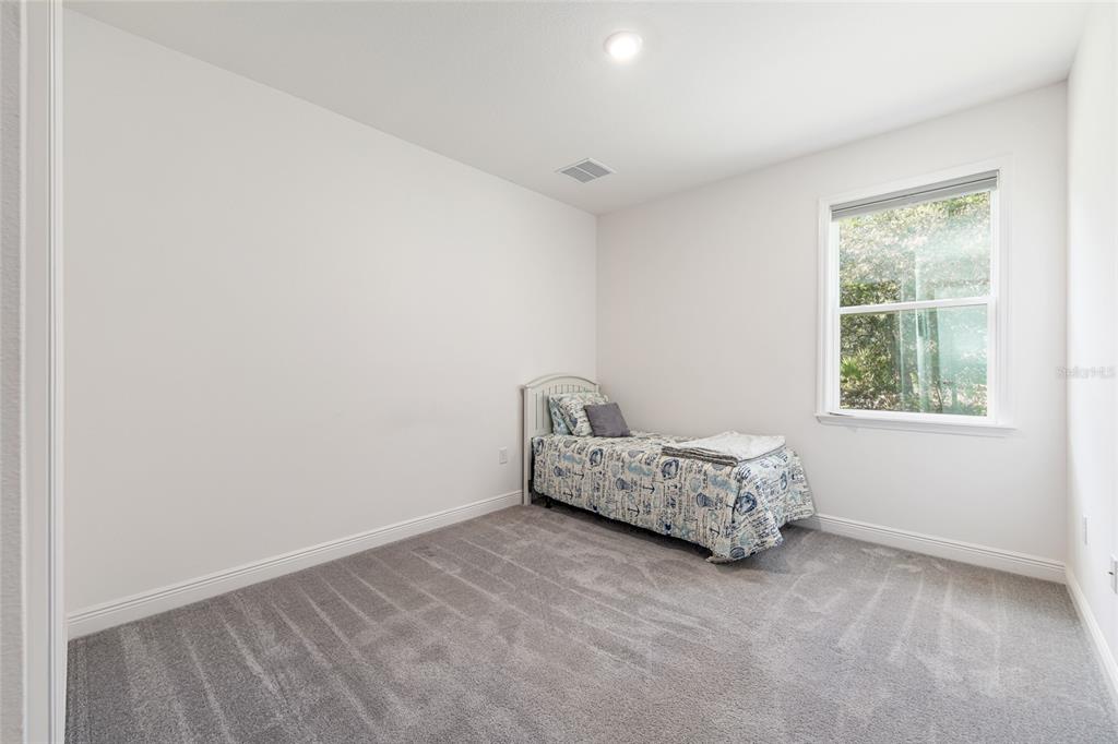 69 Grass Street Homosassa, FL 34446 - Photo 40 of 72 a bed room with a bed and a window