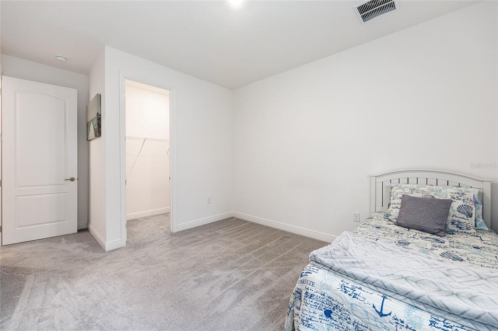 69 Grass Street Homosassa, FL 34446 - Photo 41 of 72 a bedroom with a bed and a window