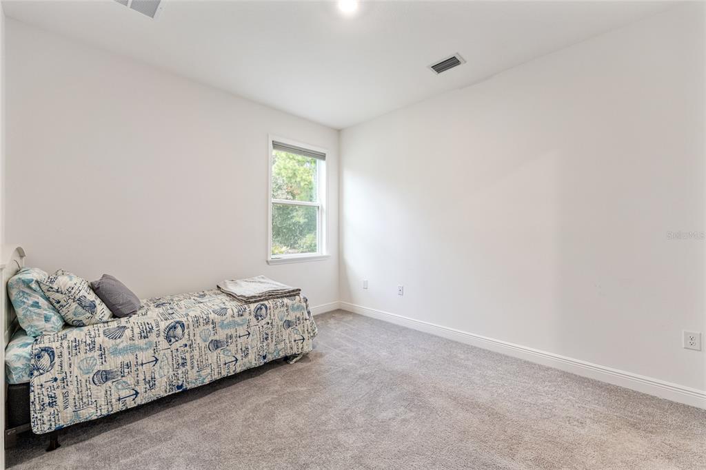 69 Grass Street Homosassa, FL 34446 - Photo 42 of 72 a bedroom with a bed and a window