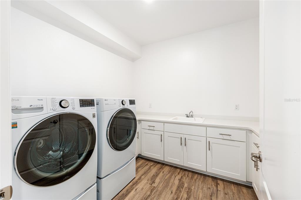 69 Grass Street Homosassa, FL 34446 - Photo 48 of 72 a utility room with dryer and washer