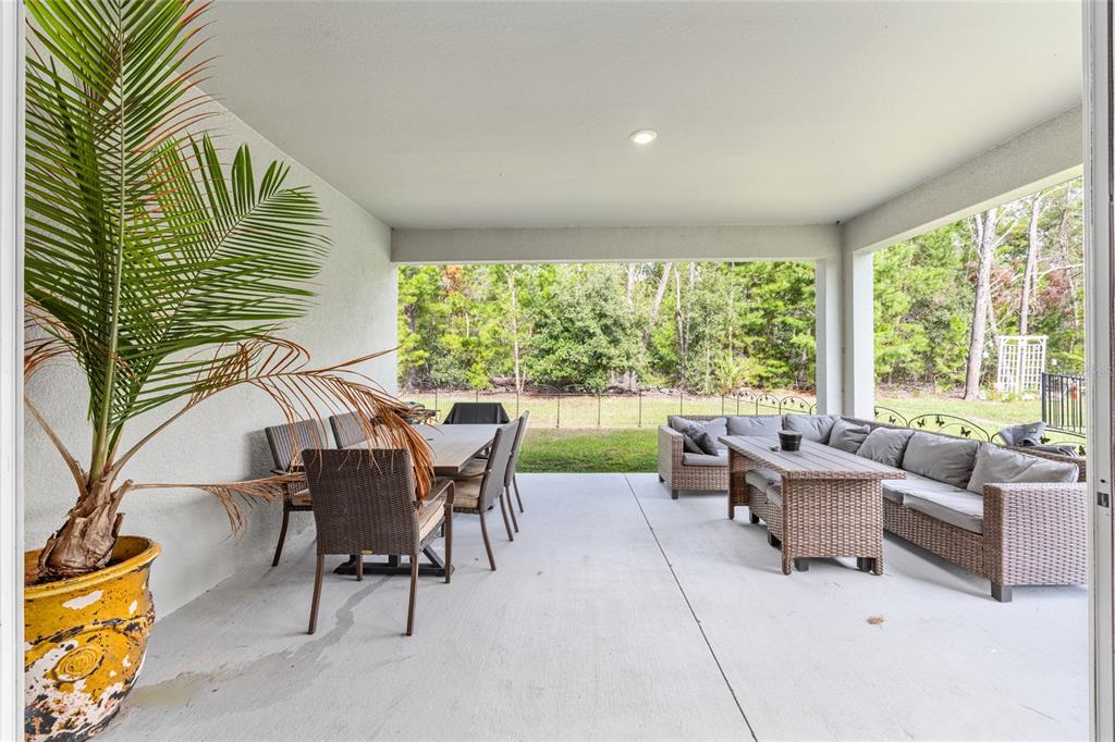 69 Grass Street Homosassa, FL 34446 - Photo 49 of 72 a living room with furniture and a large window