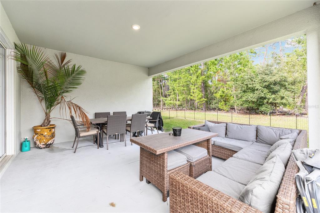 69 Grass Street Homosassa, FL 34446 - Photo 50 of 72 a living room with furniture and a large window