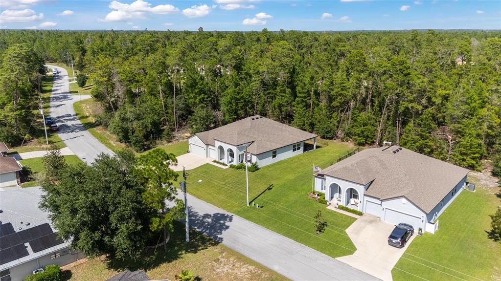 69 Grass Street Homosassa, FL 34446 - Photo 60 of 72 an aerial view of a house with a yard