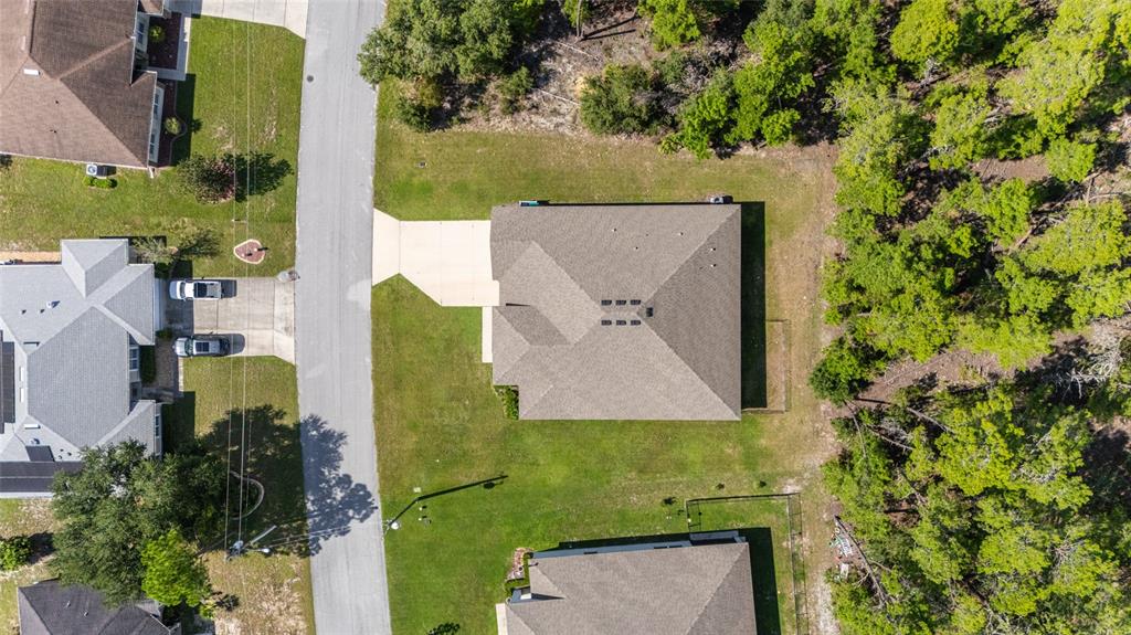 69 Grass Street Homosassa, FL 34446 - Photo 61 of 72 an aerial view of a house with a yard
