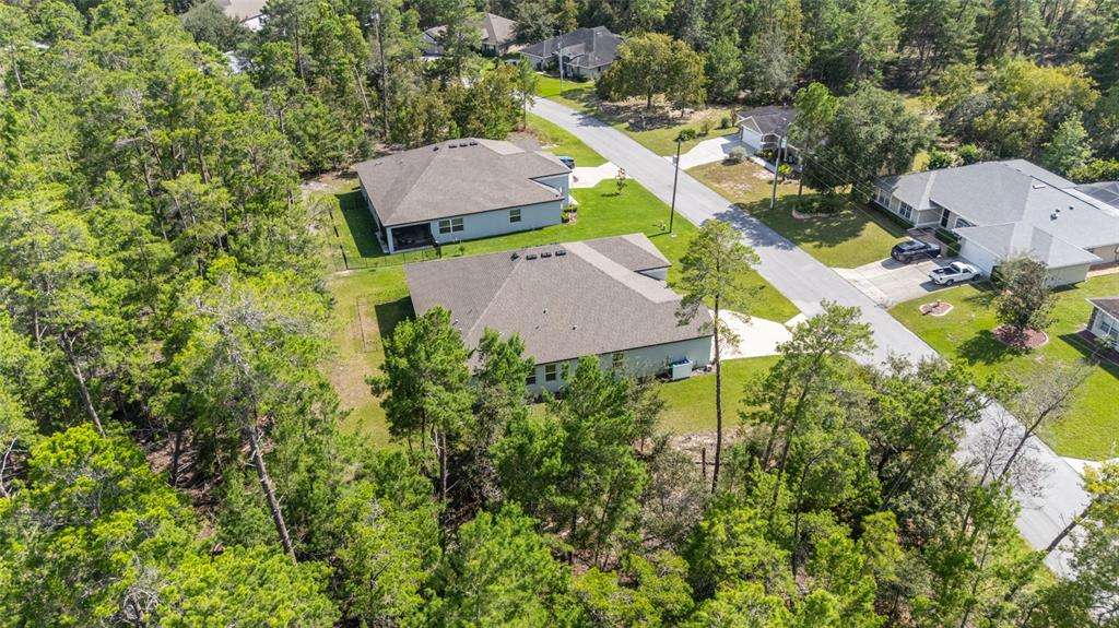 69 Grass Street Homosassa, FL 34446 - Photo 68 of 72 an aerial view of a house with yard swimming pool and outdoor seating